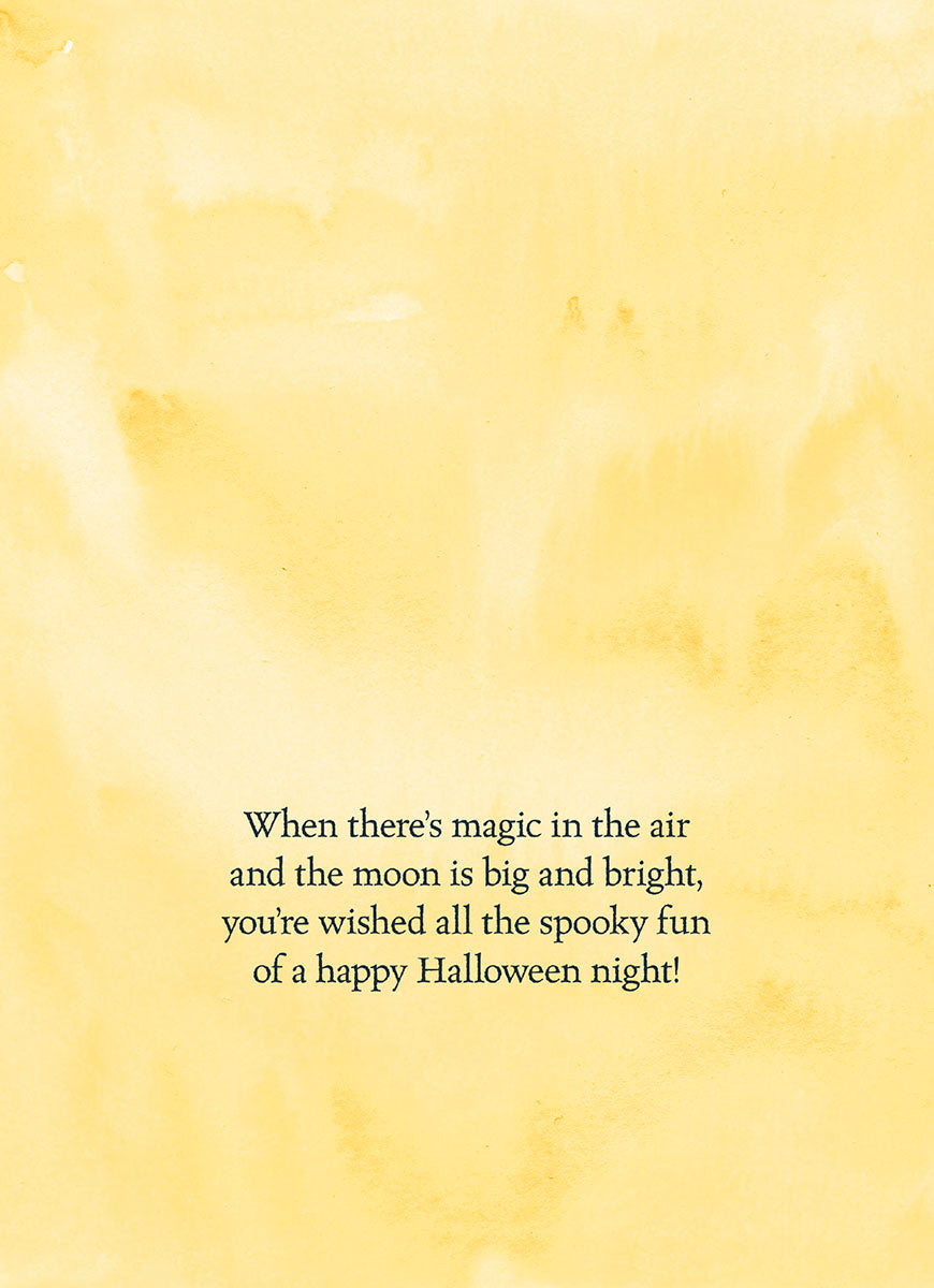 Interior of a Cute Halloween greeting card with a warm yellow watercolor background, featuring a printed message: 'When there's magic in the air and the moon is big and bright, you're wished all the spooky fun of a happy Halloween night!'