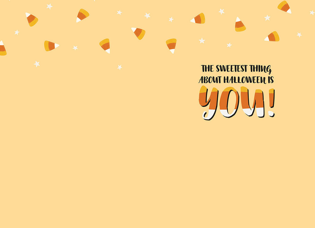Inside view of a cute greeting card with a warm, light yellow background. A border of candy corn and small white stars decorates the top edge. The heartfelt message 'THE SWEETEST THING ABOUT HALLOWEEN IS YOU!' is printed in a charming black and orange font, making it ideal for expressing affection.