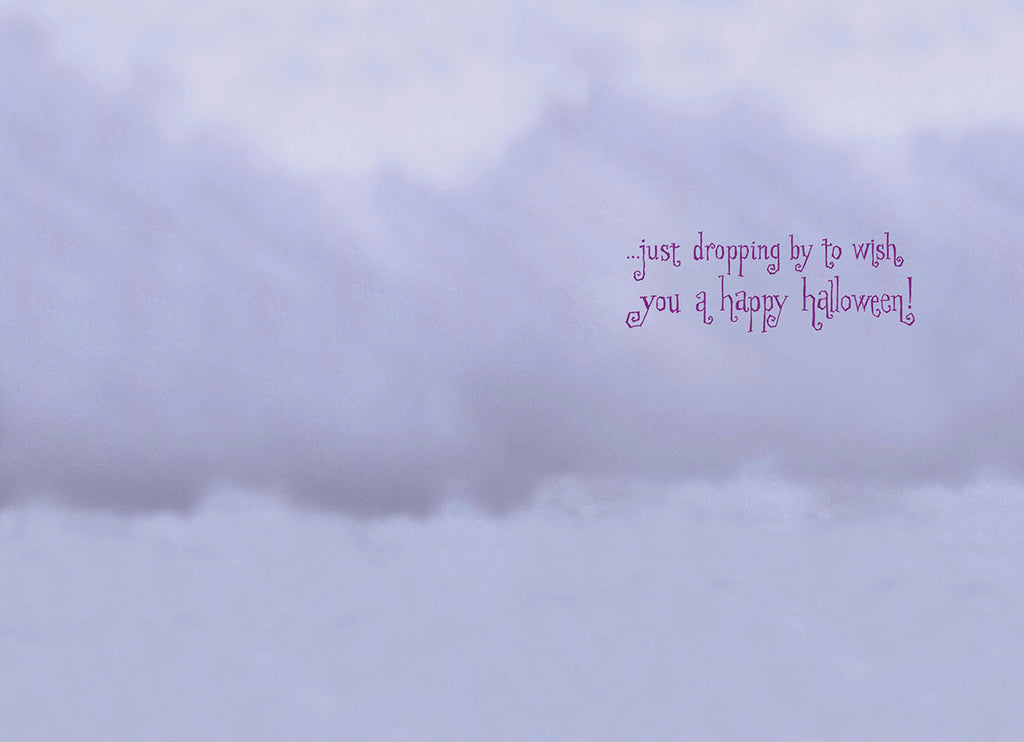 Inside of a spooky cute greeting card with a light purple and grey cloud-like background, featuring the message '...just dropping by to wish you a happy Halloween!' in whimsical purple script.