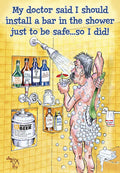 Funny birthday greeting card for men depicting a cartoon man naked in the shower, surrounded by soap bubbles and various humorous alcohol bottles, with the text 'My doctor said I should install a bar in the shower just to be safe...so I did!'
