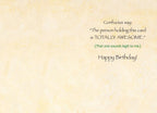 Inside view of a funny birthday card, revealing an inner message 'Confucius say: The person holding this card is TOTALLY AWESOME.' followed by '(That one sounds legit to me.) Happy Birthday!' against a textured, light cream background.