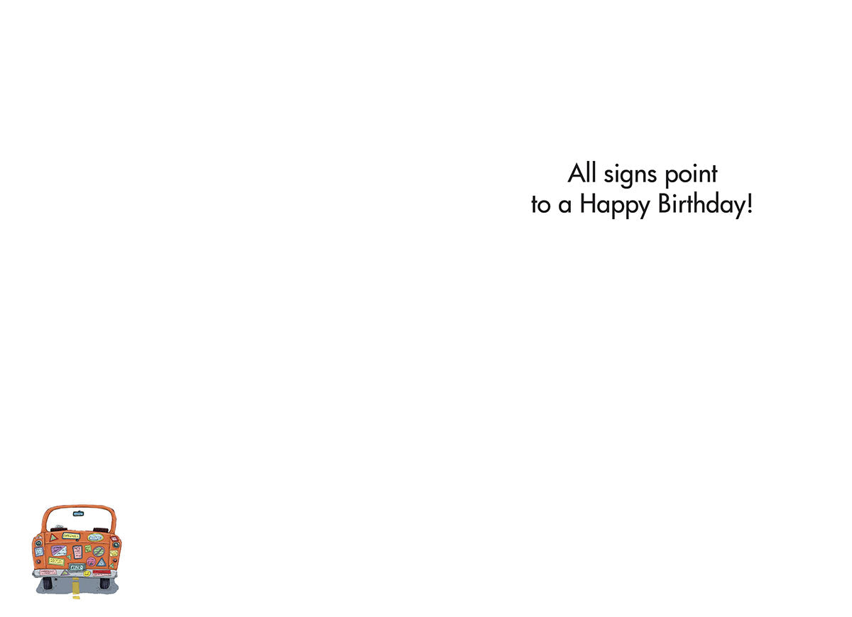 Inside of a funny birthday greeting card, featuring a small cartoon senior driver's car and the printed message: 'All signs point to a Happy Birthday!'
