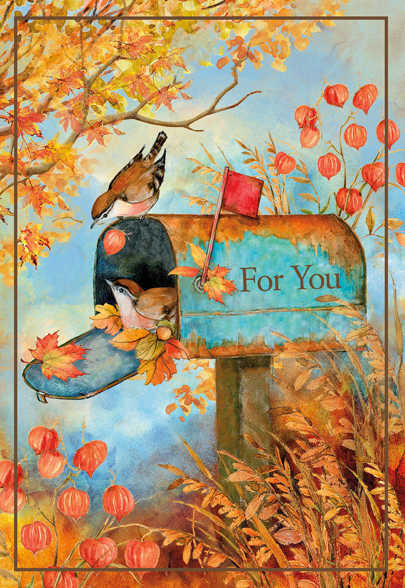 Vibrant watercolor Thanksgiving greeting card featuring two charming birds nestled in a rustic blue mailbox, surrounded by golden autumn leaves and orange Chinese lantern plants under a soft blue sky. The mailbox is inscribed with 'For You', evoking warmth and seasonal gratitude.