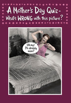 Funny Mother's Day greeting card front featuring a retro illustration of a mom waking up late and stretching in bed, smiling, with a speech bubble 'Oh my! It's already noon?' and the text 'A Mother's Day Quiz - What's WRONG with this picture?'.