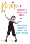 Front of a funny Mother's Day greeting card showing a clown-like woman juggling colorful balls with text: 'Mom, YOU'RE LIKE A WORLD-CLASS JUGGLER... WHO SOMEHOW MANAGES TO KEEP ALL THE CHAOS TOGETHER!'