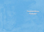 Inside of a light blue graduation card featuring elegant cursive text 'Congratulations, Graduate!' on a clean, simple background.