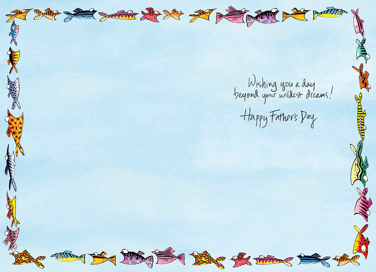 Inside view of a Father's Day greeting card, featuring a light blue background bordered by colorful cartoon fish. The message 'Wishing you a day beyond your wildest dreams! Happy Father's Day' is handwritten in the top right corner.