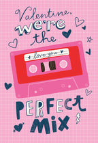 Front of a retro Valentine's Day greeting card for her, featuring a pink grid pattern, a red cassette tape with 'I love you' and text 'Valentine, we're the perfect mix'. Dark blue hearts and doodles surround the design.