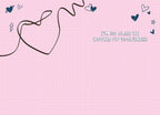 Inside of a retro romantic greeting card on a light pink grid background. A dark brown string forms a heart shape, with text 'I'm so glad we wound up together!' and scattered dark blue hearts.