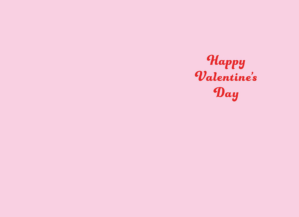 Inside of a light pink greeting card displaying the message 'Happy Valentine's Day' in elegant red script font, with ample blank space for a personalized handwritten message.