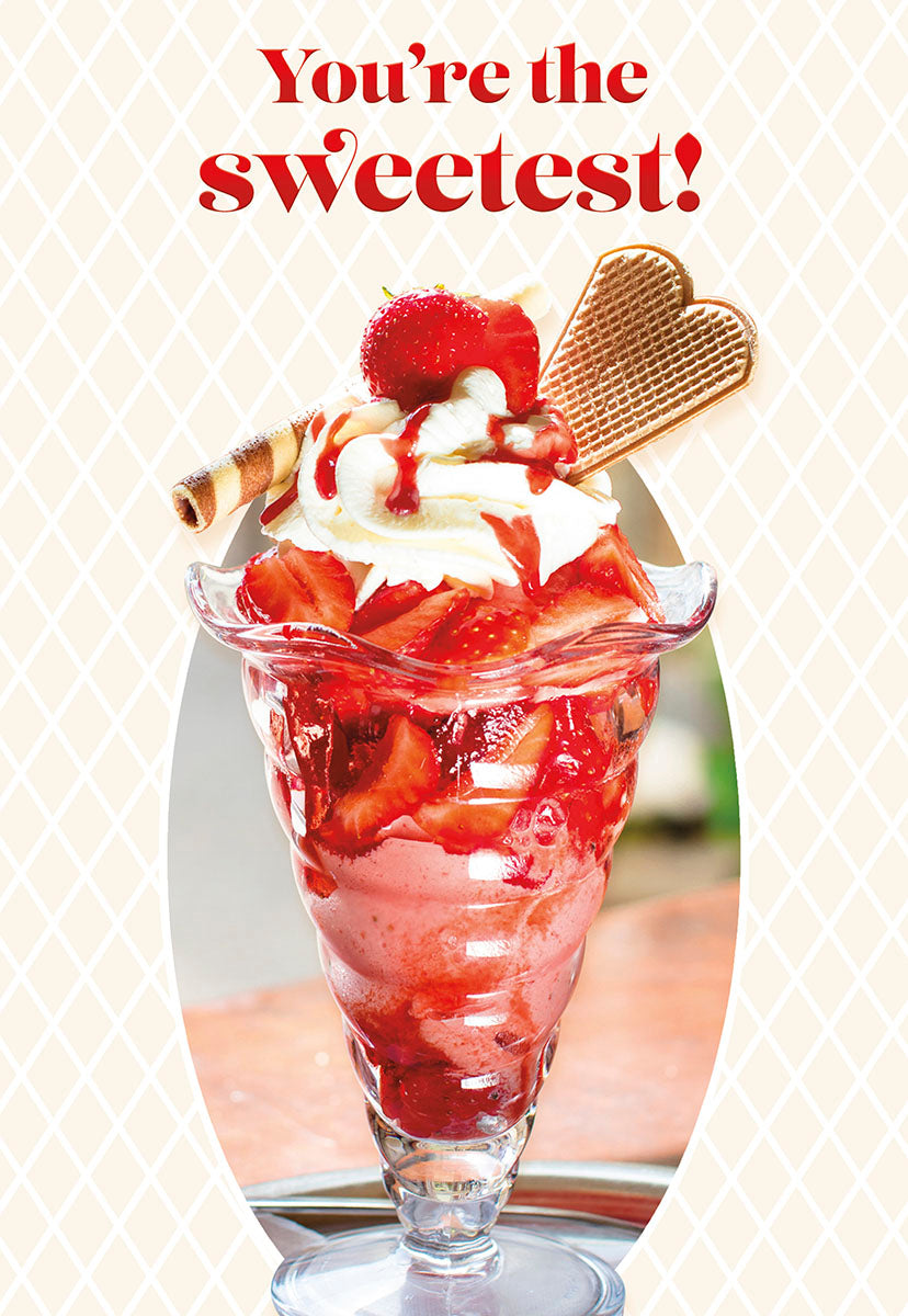 Front of a romantic Valentine's Day greeting card featuring a vibrant strawberry sundae with whipped cream, red syrup, a decorative wafer stick, and a heart-shaped waffle. The background is a subtle cream lattice pattern, and the card reads 'You're the sweetest!' in bold red text.