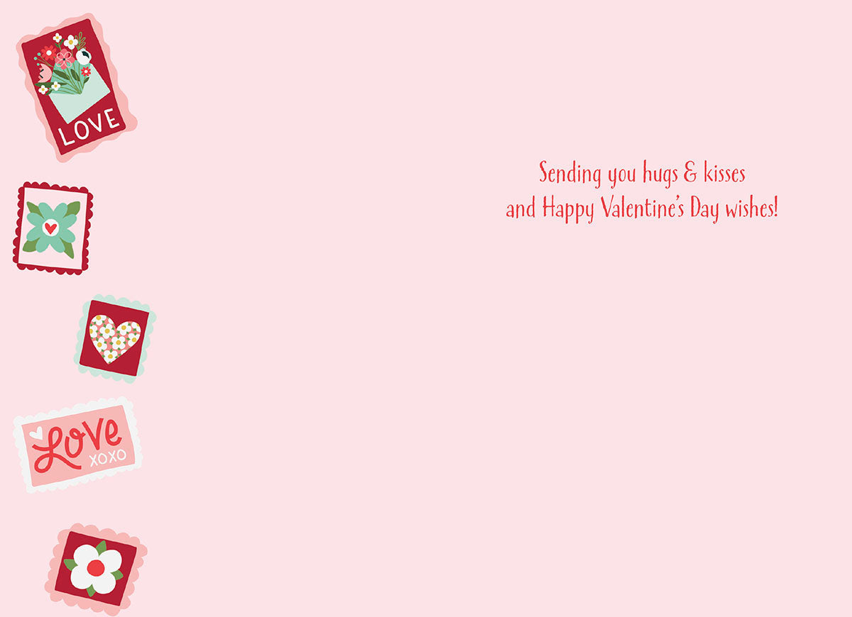 Inside of a romantic Valentine's Day greeting card with 'Sending you hugs & kisses and Happy Valentine's Day wishes!' text on a light pink background, bordered by cute love stamps.