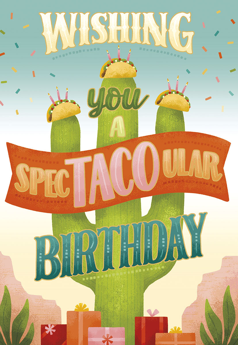 Front of a funny greeting card featuring a large green cactus with three birthday tacos topped with candles and confetti. Text reads 'Wishing you a Spec-TACO-ular Birthday' with wrapped gifts at the base in a desert scene.