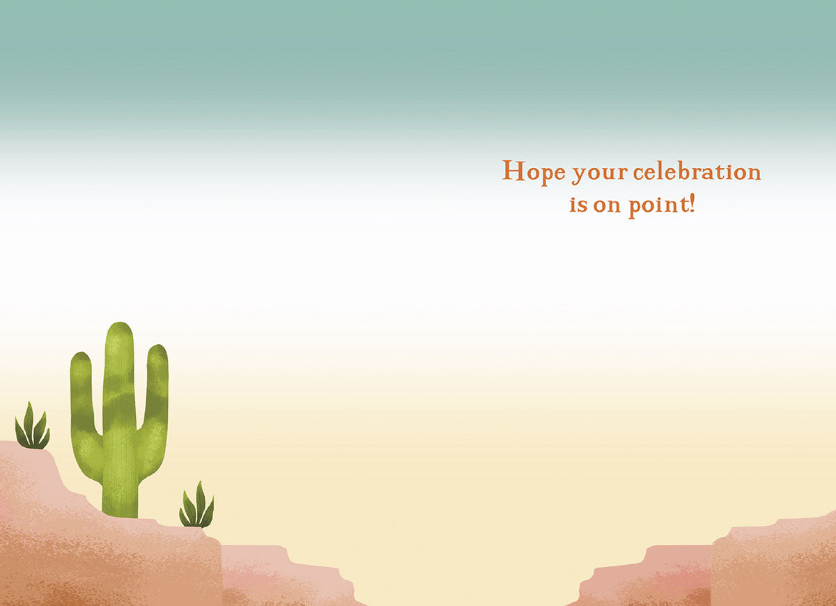 Inside of a lighthearted greeting card with a simple desert landscape, a small cactus, and text 'Hope your celebration is on point!'.
