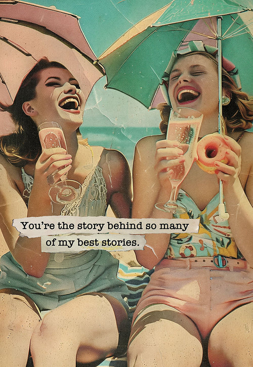 Vintage-style greeting card featuring two women laughing joyfully on a sunny beach, sharing champagne and a donut under colorful parasols, with the heartfelt quote 'You're the story behind so many of my best stories.' Perfect for a best friend or sister.