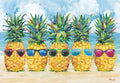 Funny greeting card with five anthropomorphic pineapples wearing colorful sunglasses on a sunny beach, ideal for summer greetings, friendship, or any occasion.