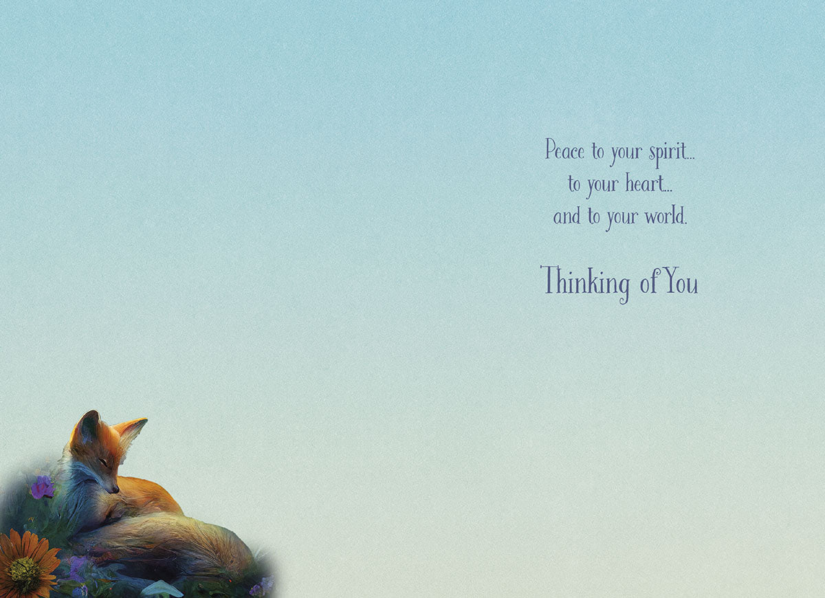 Inside of a 'Thinking of You' greeting card with a soft blue gradient background. Text reads: 'Peace to your spirit... to your heart... and to your world. Thinking of You.' A small sleeping fox and flowers are visible in the bottom left corner.