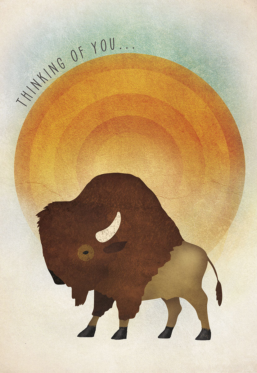 Front of an encouraging greeting card featuring a majestic brown bison silhouette against a warm orange sun, with the words 'THINKING OF YOU...' in an arc above.