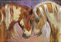 Close-up of two horses, a pinto and a palomino, nuzzling affectionately, symbolizing strong bonds and loyal companionship, framed in gold.