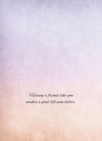 Inside of a greeting card with elegant script text 'Having a friend like you makes a good life even better.' on a soft, warm pastel background.