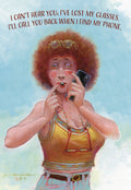 Front of a humorous birthday card featuring a bewildered woman with red curly hair, glasses on her head, holding a phone to her ear while her fingers are in her mouth, with the text: "I CAN'T HEAR YOU; I'VE LOST MY GLASSES. I'LL CALL YOU BACK WHEN I FIND MY PHONE."