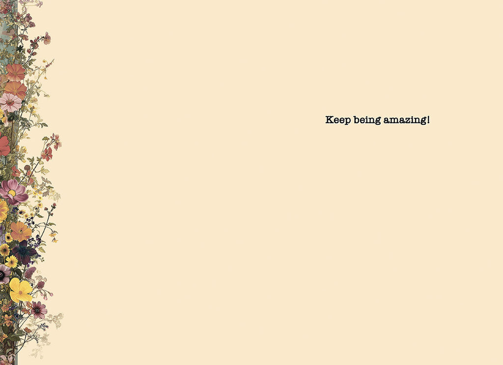Inside of an encouraging greeting card with a delicate floral border and the heartfelt message 'Keep being amazing!' against a cream background.