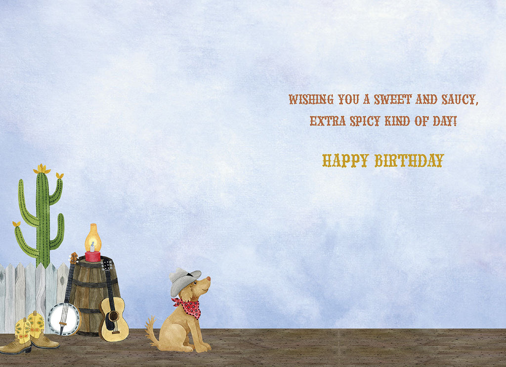 Inside view of a fun greeting card with a light blue sky background, country-themed elements like a cactus and a cowboy dog, featuring the message 'Wishing you a sweet and saucy, extra spicy kind of day! Happy Birthday'.