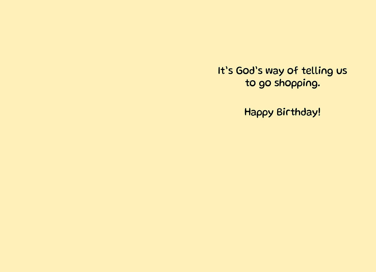 Inside of a humorous greeting card, with text 'It's God's way of telling us to go shopping. Happy Birthday!' on a light yellow background.