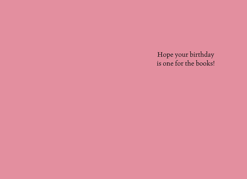The inside of a funny birthday greeting card for her, showing a solid light pink background with elegant black text that reads: 'Hope your birthday is one for the books!'