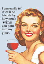 Vintage style greeting card featuring a smiling woman with red curly hair holding a glass of red wine, with the witty text 'I can easily tell if we'll be friends by how much wine you pour into my glass.' Perfect for wine lovers.