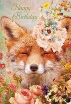 Close-up of a whimsical greeting card featuring a serene fox with closed eyes, adorned with a large, delicate pink peony and a cluster of colorful wildflowers including blue forget-me-nots and a ladybug, set against a lush, vibrant garden background with 'Happy Birthday' in elegant green script.