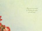 Inside of a serene greeting card with a light green, watercolor-effect background, showing a delicate floral arrangement of red and pink roses with green leaves in the bottom left corner, and elegant green script text on the right side reading 'May you be surrounded by everything that makes you smile today!'