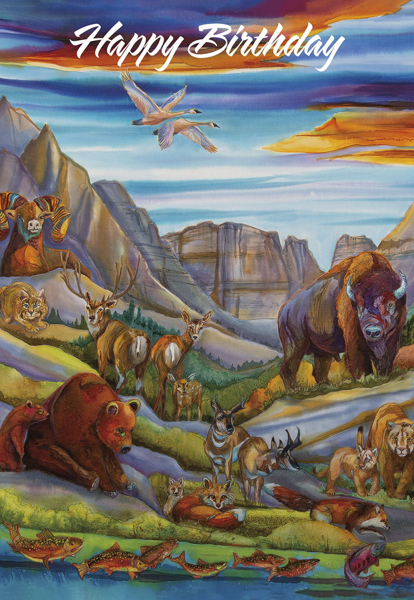 Front of a beautiful nature-themed birthday card depicting a vibrant watercolor landscape with mountains, a river, and various animals including bears, deer, bison, bighorn sheep, foxes, and flying geese under a colorful sky.