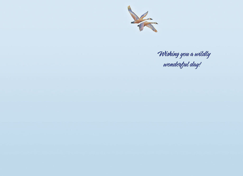 Inside of a lighthearted birthday card featuring two geese flying against a serene blue sky with the message 'Wishing you a wildly wonderful day!' in elegant script.