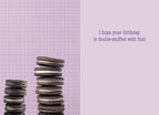 Inside of a light purple gingham greeting card with two stacks of chocolate cream cookies and text: 'I hope your birthday is double-stuffed with fun!'. Ideal for sending sweet wishes to a young one.