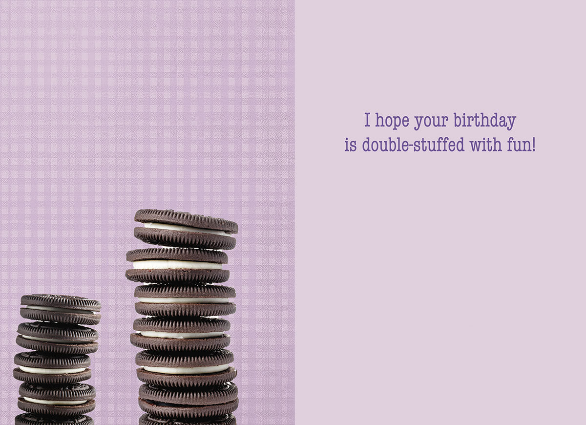 Inside of a light purple gingham greeting card with two stacks of chocolate cream cookies and text: 'I hope your birthday is double-stuffed with fun!'. Ideal for sending sweet wishes to a young one.