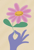 Charming greeting card featuring a purple hand holding a pink flower with a cheerful smiley face center, on a textured wavy cream background. Ideal for sending smiles to a friend.