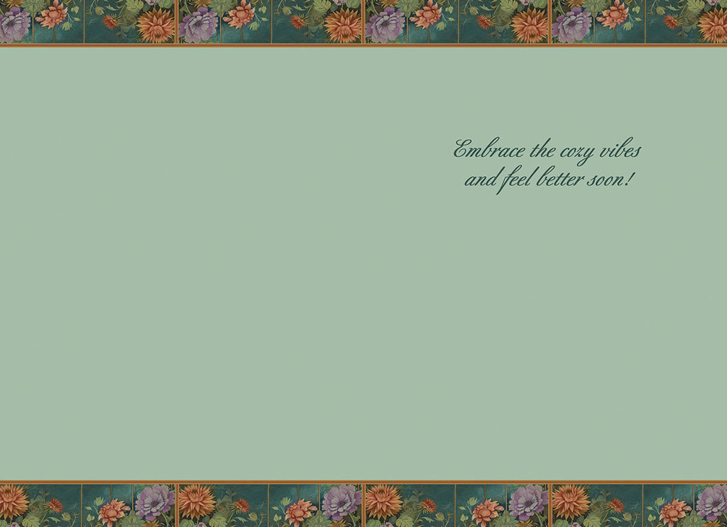 Inside of a 'Get Well' card for children, displaying a soft light green background. The top and bottom borders feature intricate floral patterns matching the card's front design. The elegant script reads: 'Embrace the cozy vibes and feel better soon!', providing a heartfelt message for a speedy recovery.