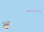 Open birthday greeting card with a light blue interior, featuring a small matching tiered cake design and the sweet message: 'Hope your day is all sweetness and sparkles!'
