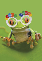 Cute green tree frog wearing white novelty party glasses with colorful 'Happy Birthday' balloons on a vibrant green background, perfect for a joyful celebration card.