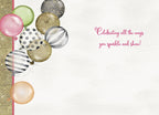 Inside of an encouraging birthday card for a friend, displaying assorted festive balloons and the heartfelt message 'Celebrating all the ways you sparkle and shine!' in elegant script.
