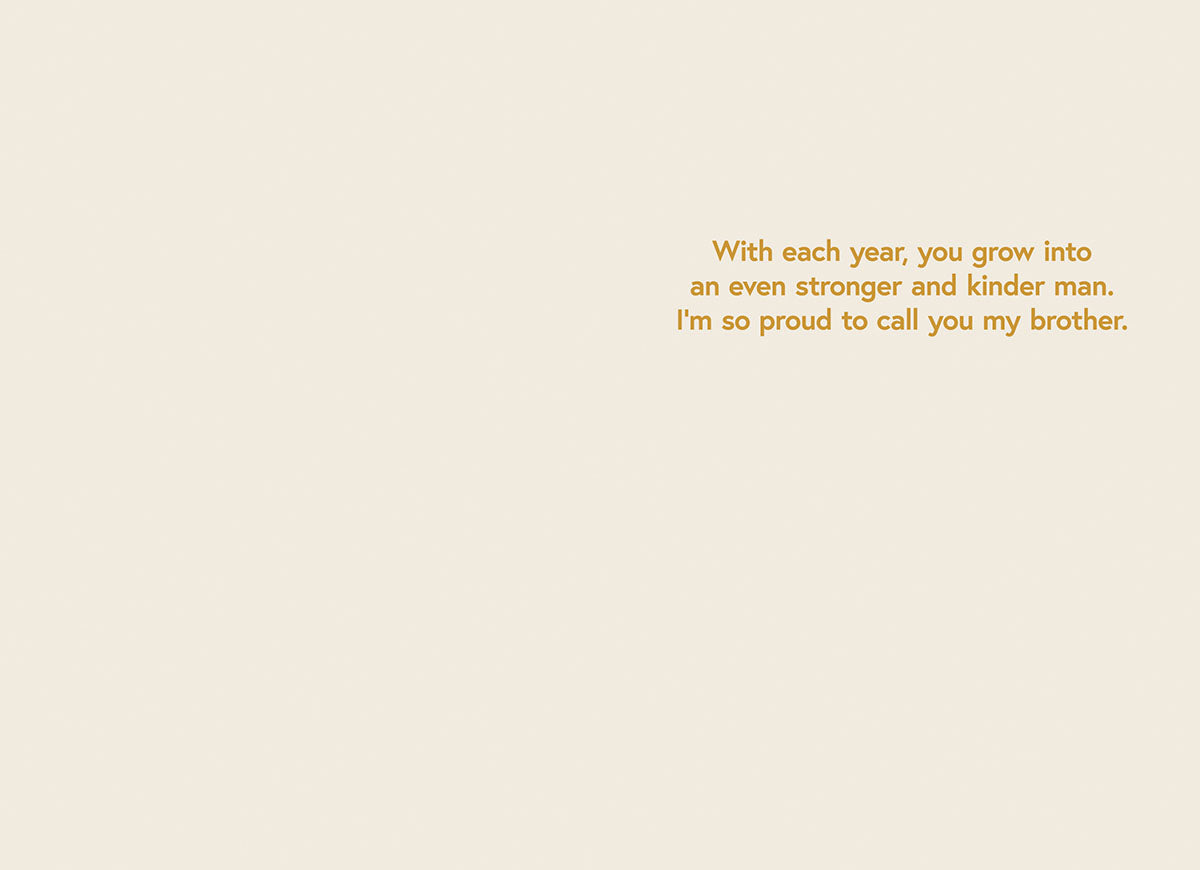 Inside of a heartfelt birthday card for a brother, showing a warm message on a light beige background: 'With each year, you grow into an even stronger and kinder man. I'm so proud to call you my brother.'