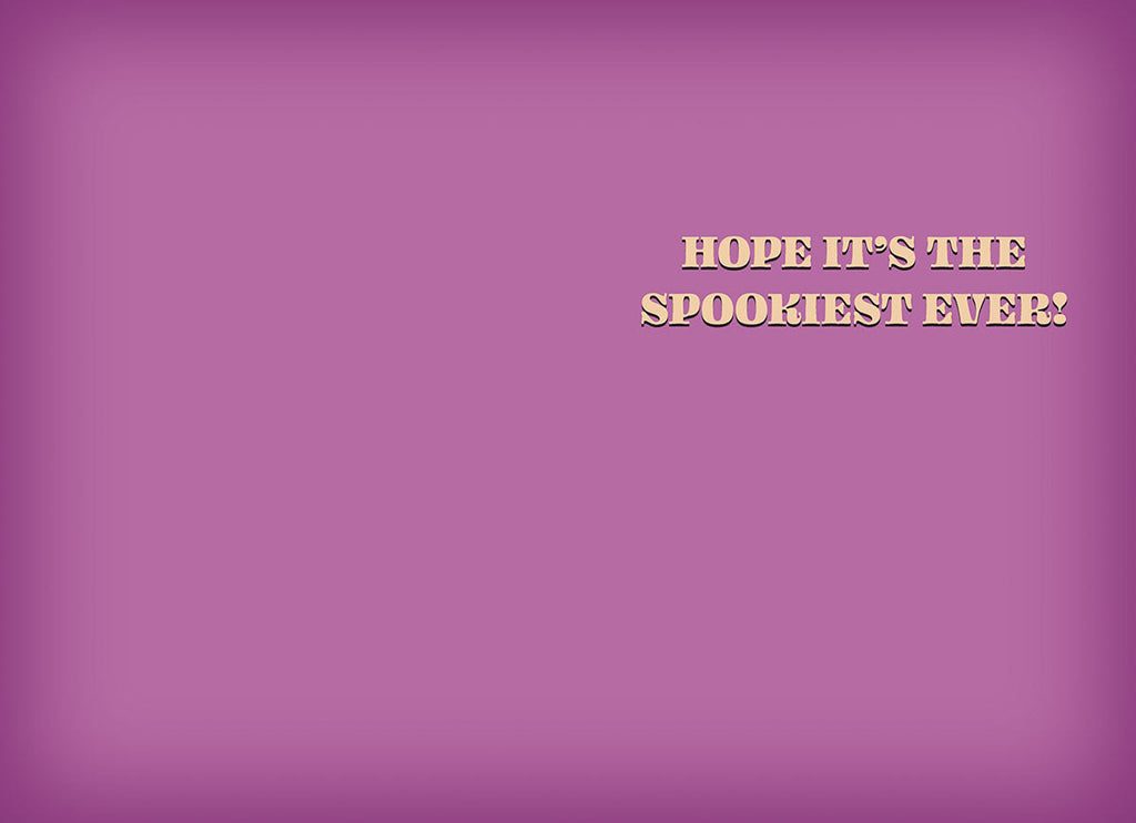 Inside of a cute greeting card featuring a simple purple background with the playful message 'HOPE IT'S THE SPOOKIEST EVER!' in bold orange text.