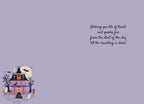 Inside of a cute Halloween greeting card with a small haunted house illustration and a printed message: 'Wishing you lots of treats and spooky fun from the start of the day till the haunting is done!' on a light purple background.