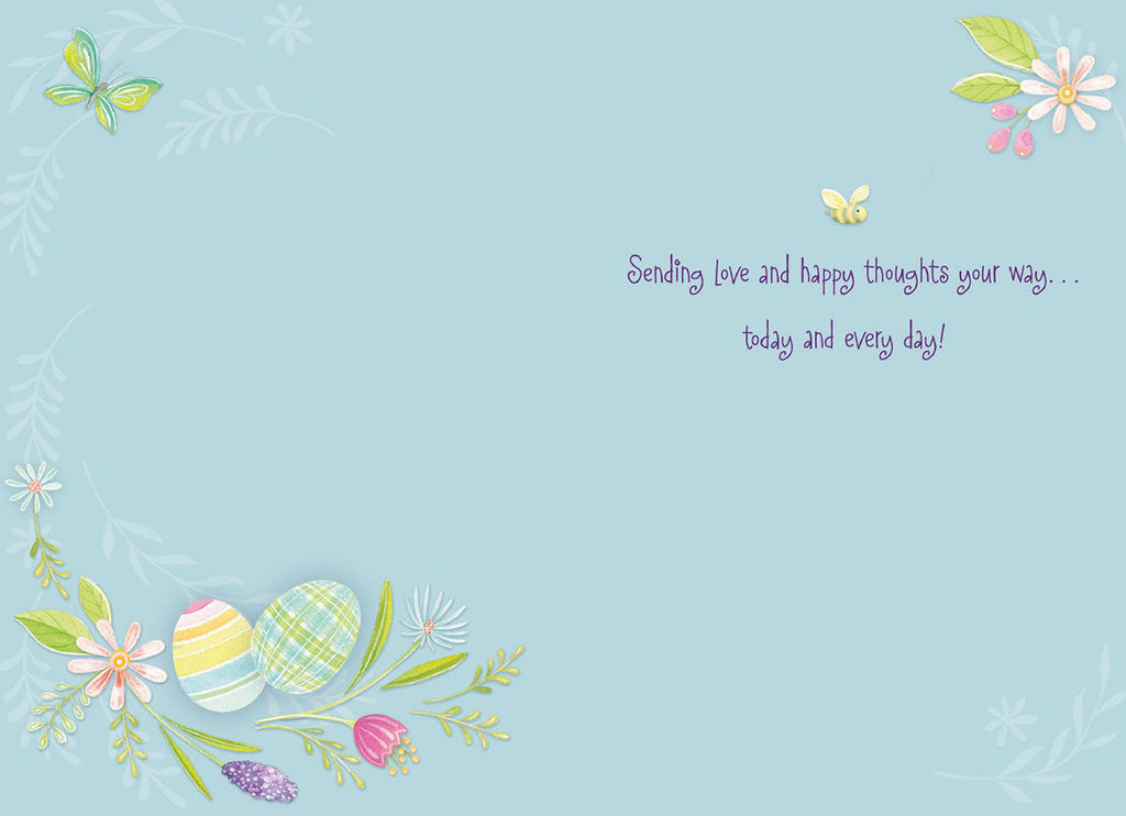 Inside of a thoughtful Easter card with a light blue background, displaying the heartfelt message 'Sending love and happy thoughts your way... today and every day!' alongside decorative watercolor eggs and floral accents.