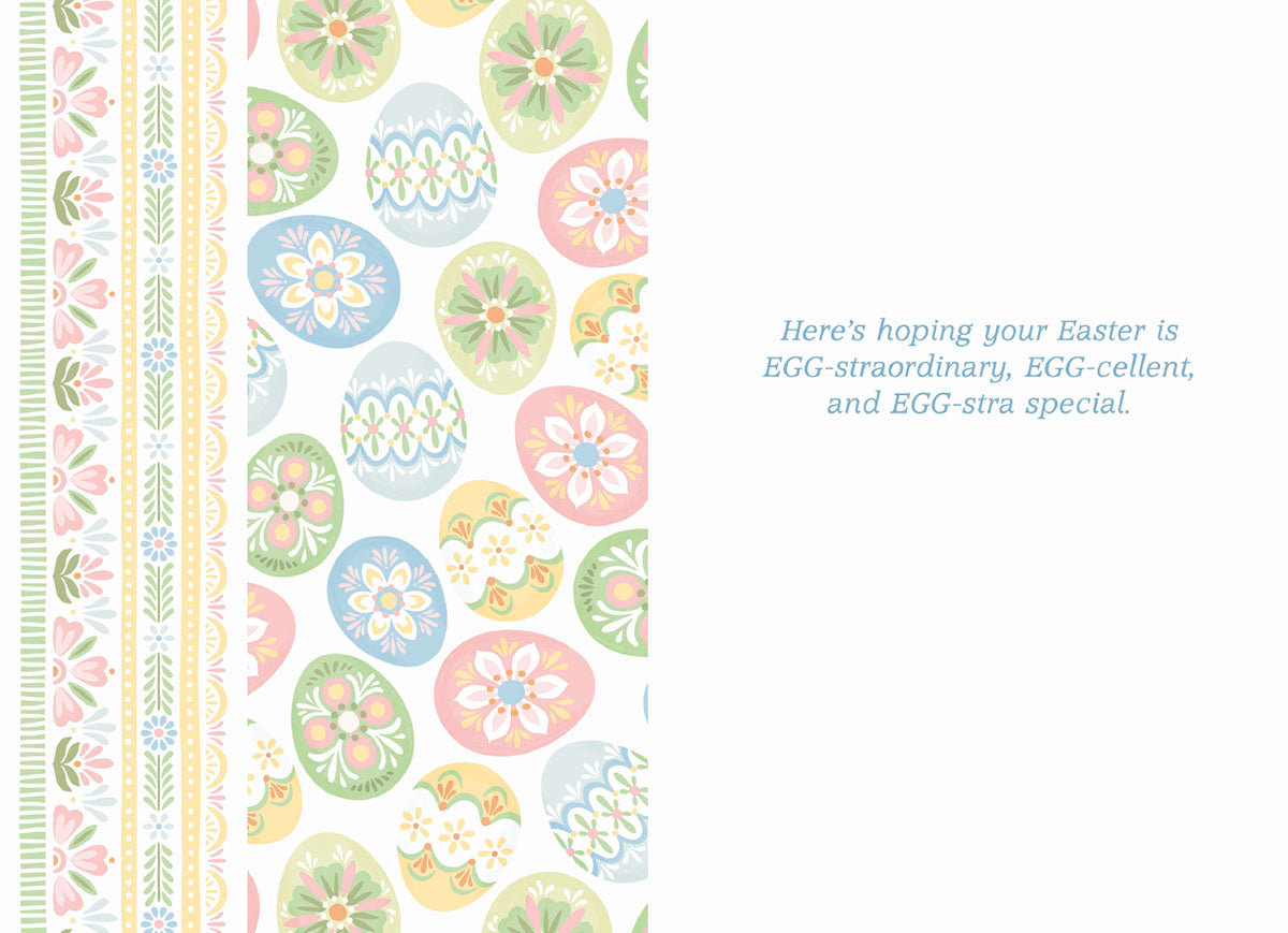 Inside view of a cute Easter card, displaying the message 'Here's hoping your Easter is EGG-straordinary, EGG-cellent, and EGG-stra special.' alongside a pastel egg and floral border.