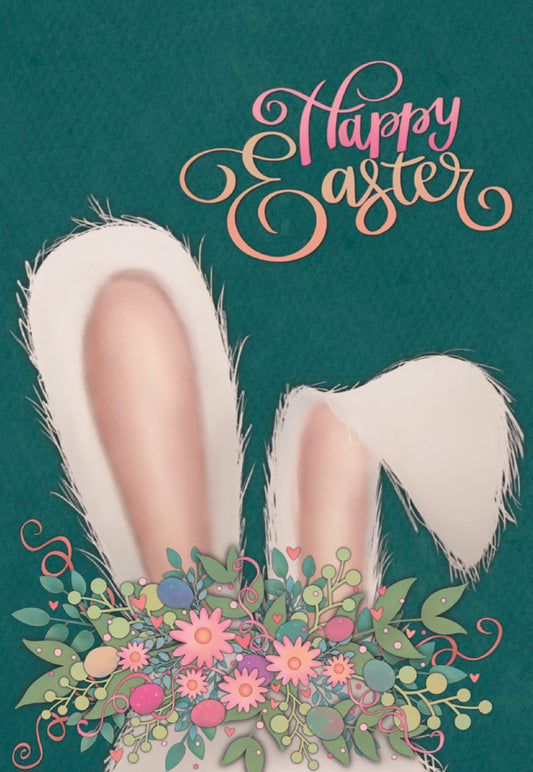 Closeup of white bunny ears adorned with a pink and green flower crown and colorful eggs, on a dark green background.