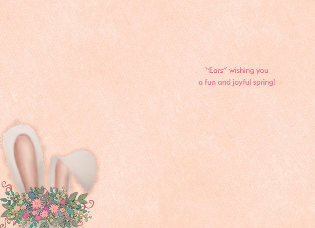 Inside of a light peach colored greeting card with a small illustration of white bunny ears with a floral and egg bouquet in the bottom left corner. The right side of the card features the sweet, punny message: '"Ears" wishing you a fun and joyful spring!'.