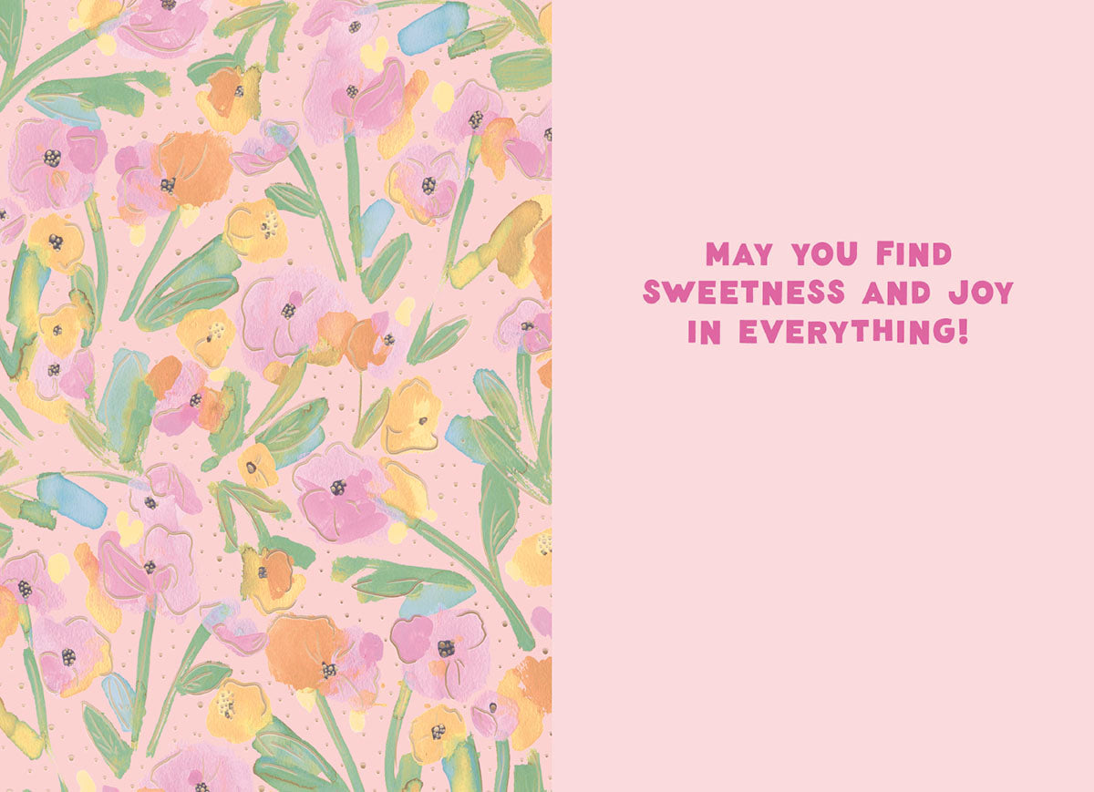 Inside of a cheerful floral greeting card with a painterly pattern of pink, yellow, and green flowers on a light pink background, featuring the uplifting message 'MAY YOU FIND SWEETNESS AND JOY IN EVERYTHING!' on the right panel.