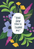 Front of a Mother's Day greeting card featuring a vibrant botanical illustration with purple, yellow, and pink flowers and green leaves on a dark blue background. The card reads: "ONE DAY YOU'LL THANK ME" in a playful white script.